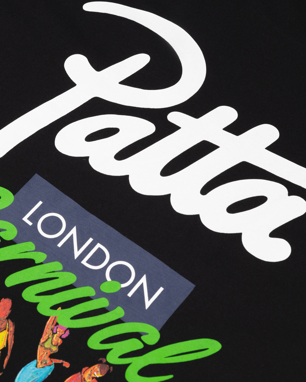 Detail of the Patta London Carnival script logo print on a black cotton T-shirt.